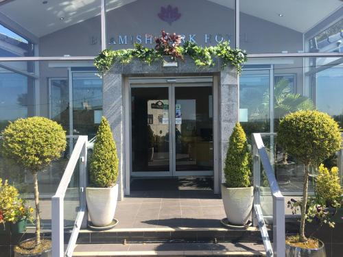 a front door of a building with plants and flowers at Beamish Park Hotel in Beamish