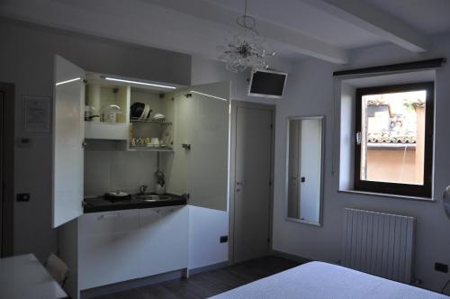 a bathroom with a sink and a mirror at B&B Albornoz in Urbino