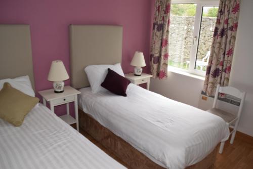 Voodi või voodid majutusasutuse Ballyvaughan Cottages toas