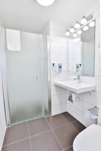 Un baño de Hotel Poseidon