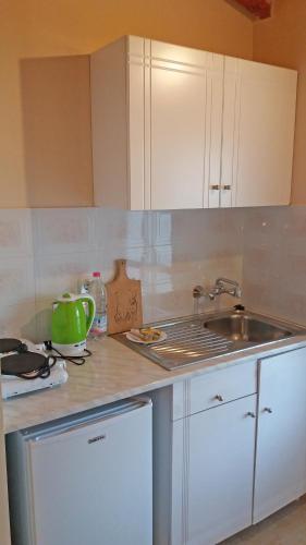 a kitchen with a sink and a counter top at Giannis Studios in Alykes