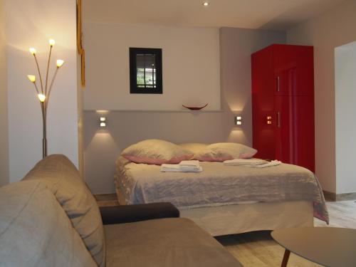 Een bed of bedden in een kamer bij Les Agaves