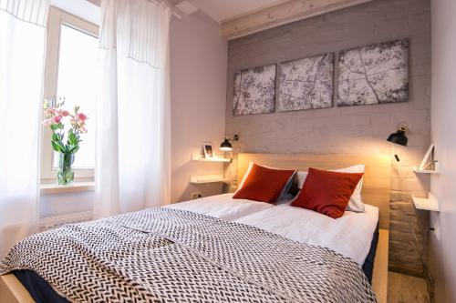 Ένα ή περισσότερα κρεβάτια σε δωμάτιο στο Sunny and compact apartment
