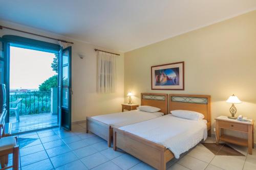 Ένα ή περισσότερα κρεβάτια σε δωμάτιο στο Kyveli Hotel Apartments