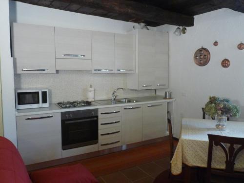 A kitchen or kitchenette at Apartments Cusius and Horta