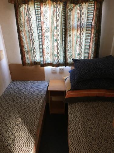 Voodi või voodid majutusasutuse Vigio Brasta camping toas