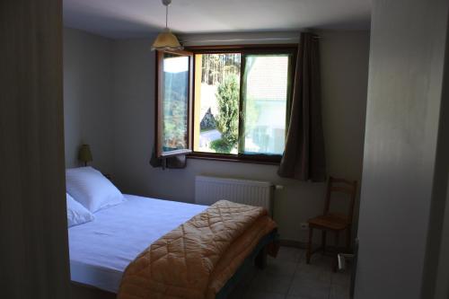 Ένα ή περισσότερα κρεβάτια σε δωμάτιο στο La Maison Jaune