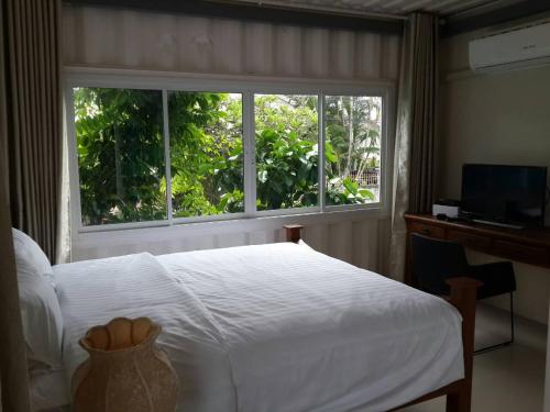 Giường trong phòng chung tại Farsai Homestay