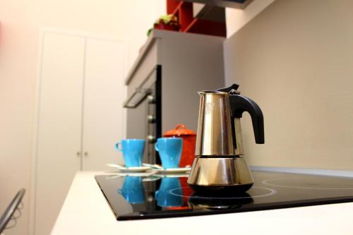 a tea kettle sitting on a counter in a kitchen at Dafne in Ostuni