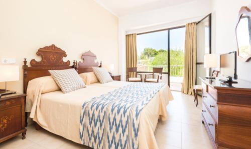 Postel nebo postele na pokoji v ubytování Hotel Gaya