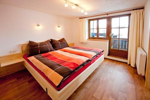 Posteľ alebo postele v izbe v ubytovaní Bauernhof Mödling