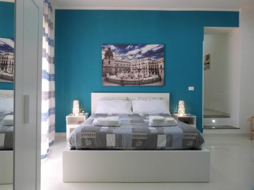 A bed or beds in a room at Casa Principe Maqueda