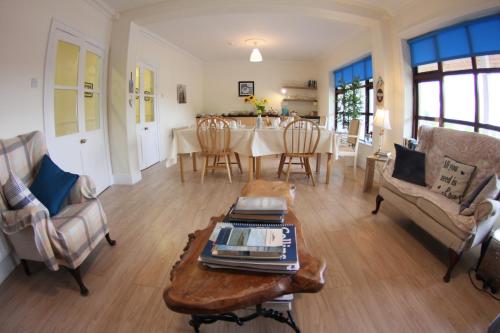 a living room with a table and chairs at Slidala B&B in Roscrea