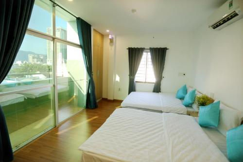 Postel nebo postele na pokoji v ubytování DaNa Home Hotel - Apartment