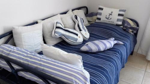 Ένα ή περισσότερα κρεβάτια σε δωμάτιο στο Les Mouettes