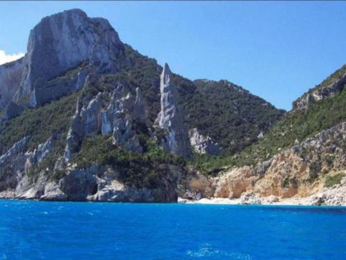 a view of a mountain with a body of water at Hotel San Francisco in Cala Gonone