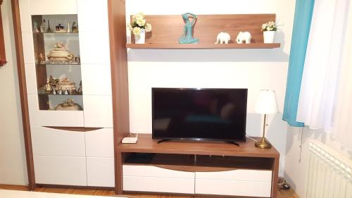 a living room with a television on a table at Apartment Dalia in Sarajevo