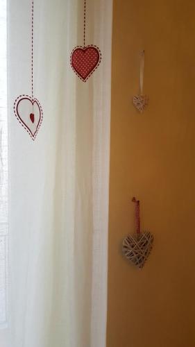 a room with a curtain with hearts on it at Casa vacanze Cristina in Imperia