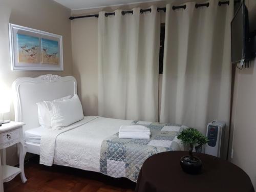 Ένα ή περισσότερα κρεβάτια σε δωμάτιο στο Hostal Pehuenche
