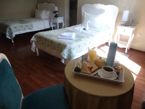 Ένα ή περισσότερα κρεβάτια σε δωμάτιο στο Hostal Pehuenche