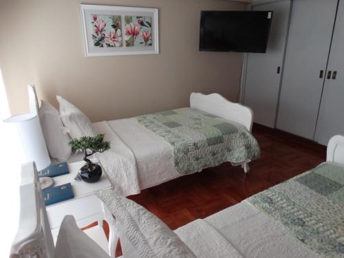 Ένα ή περισσότερα κρεβάτια σε δωμάτιο στο Hostal Pehuenche