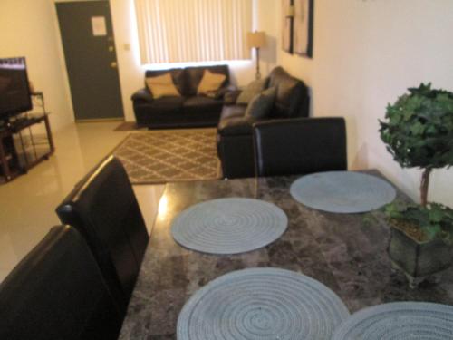 a living room with a table with two chairs at Pedro's Place in Tamuning