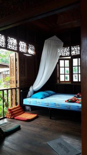 Postel nebo postele na pokoji v ubytování Chatawan Homestay