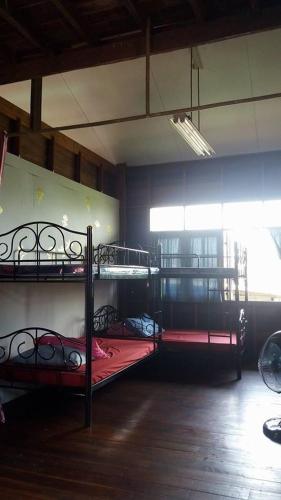 Postel nebo postele na pokoji v ubytování Chatawan Homestay