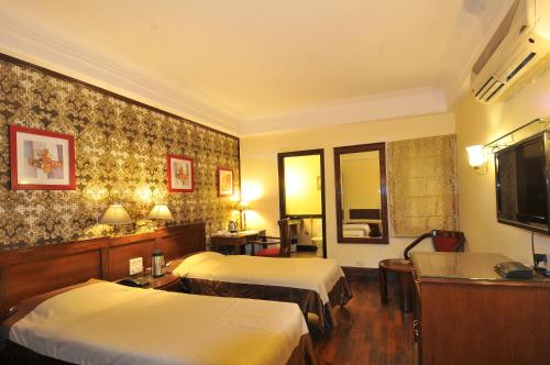 TV a/nebo společenská místnost v ubytování Qutub Residency