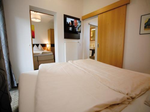 Кровать или кровати в номере Hotel Diana