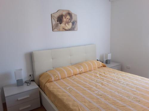 Krevet ili kreveti u jedinici u okviru objekta Appartamento Poggio Romantico