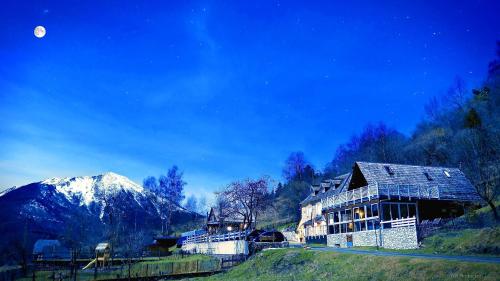 a house on a hill with a mountain in the background at Le Solayan in Couledoux