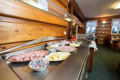 a buffet line with many plates of food on it at Chata Pod lipami in Rokytnice nad Jizerou