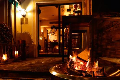 a fire pit in the middle of a street at night at Seehotel Luitpold in Tegernsee