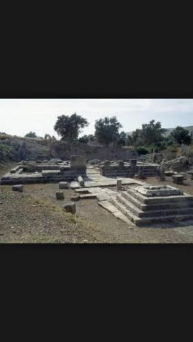a group of buildings in a field with trees at Heraklion Gortyn Phaistos House in Mitrópolis