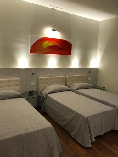 Postel nebo postele na pokoji v ubytování NovaHotel