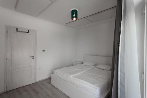 Voodi või voodid majutusasutuse Vitorlás Apartman toas