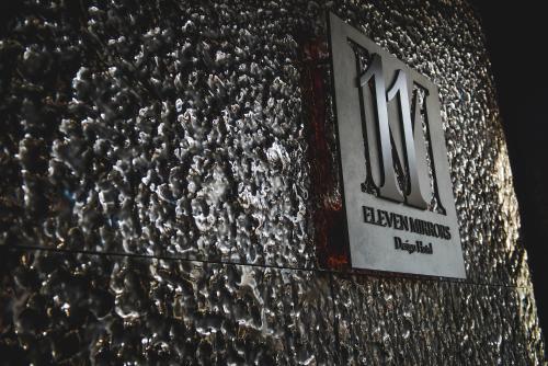 a building with a sign on the side of it at 11 Mirrors Design Hotel in Kyiv
