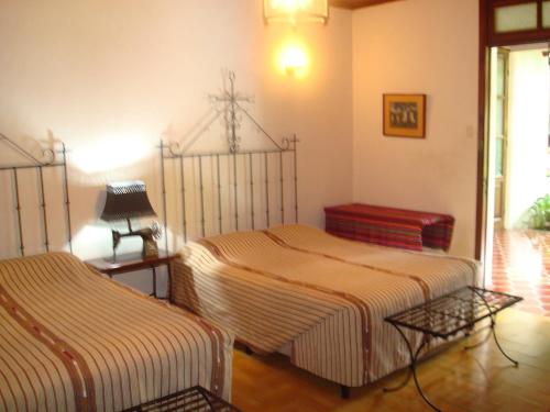 Ліжко або ліжка в номері Hotel Casa Duranta