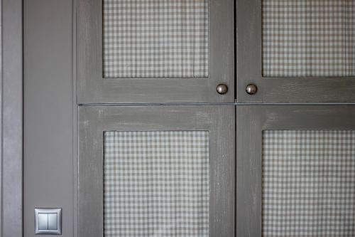 a metal door with four glass panels on it at Esperance 1 in Ermoupoli
