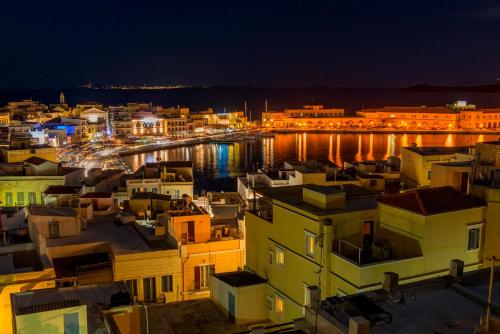a view of a city at night at Ethrion in Ermoupoli