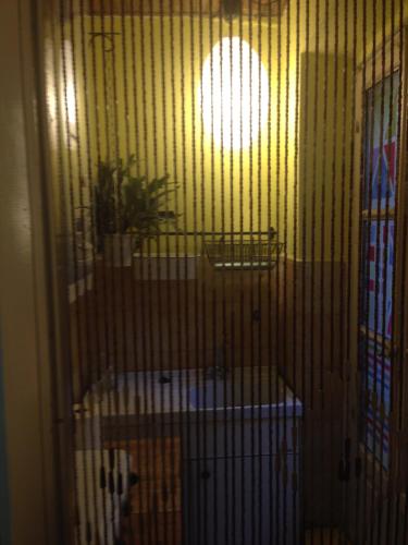 a room with a cage with a dog in it at Mood Villa Glori in Pavia