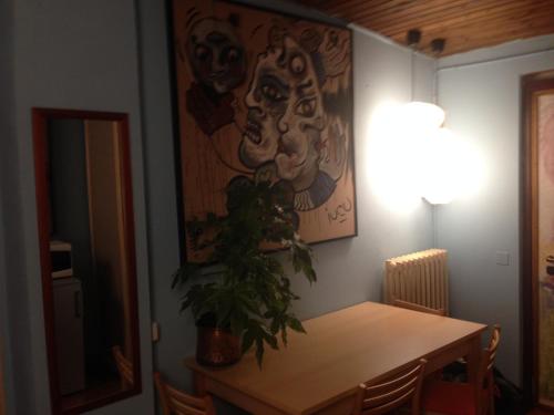 a dining room with a table with a plant on it at Mood Villa Glori in Pavia