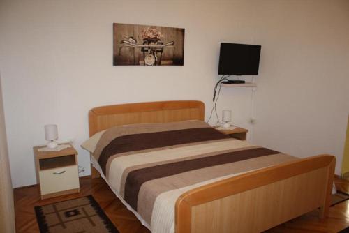 Postel nebo postele na pokoji v ubytování Apartments Miše