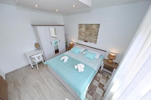 Postel nebo postele na pokoji v ubytování Apartment Nela