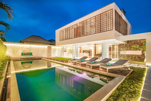 an image of a house with a swimming pool at Villa Kamag Seminyak in Seminyak