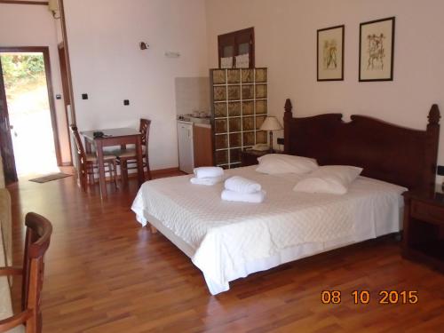 Ένα ή περισσότερα κρεβάτια σε δωμάτιο στο Hotel Aglaida Apartments 