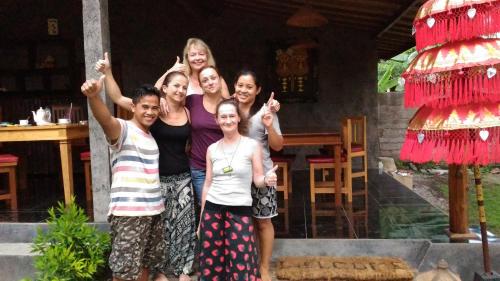 a group of people posing for a picture at Menjangan View in Banyuwedang