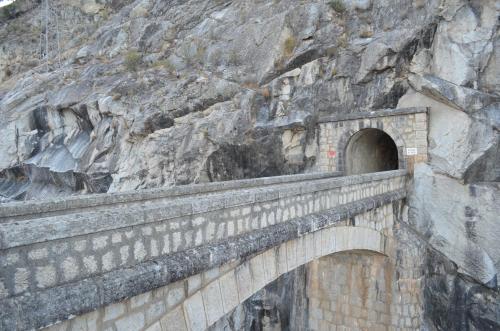 a bridge built into the side of a mountain at Apartamentos Paraje San Gines in Andújar