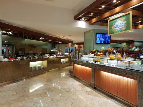 a restaurant with a buffet line in a hotel at Marco Polo Plaza Cebu in Cebu City